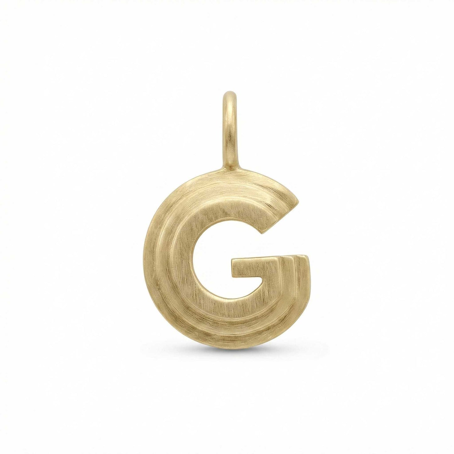 Gold letter 'G' pendant on a white background