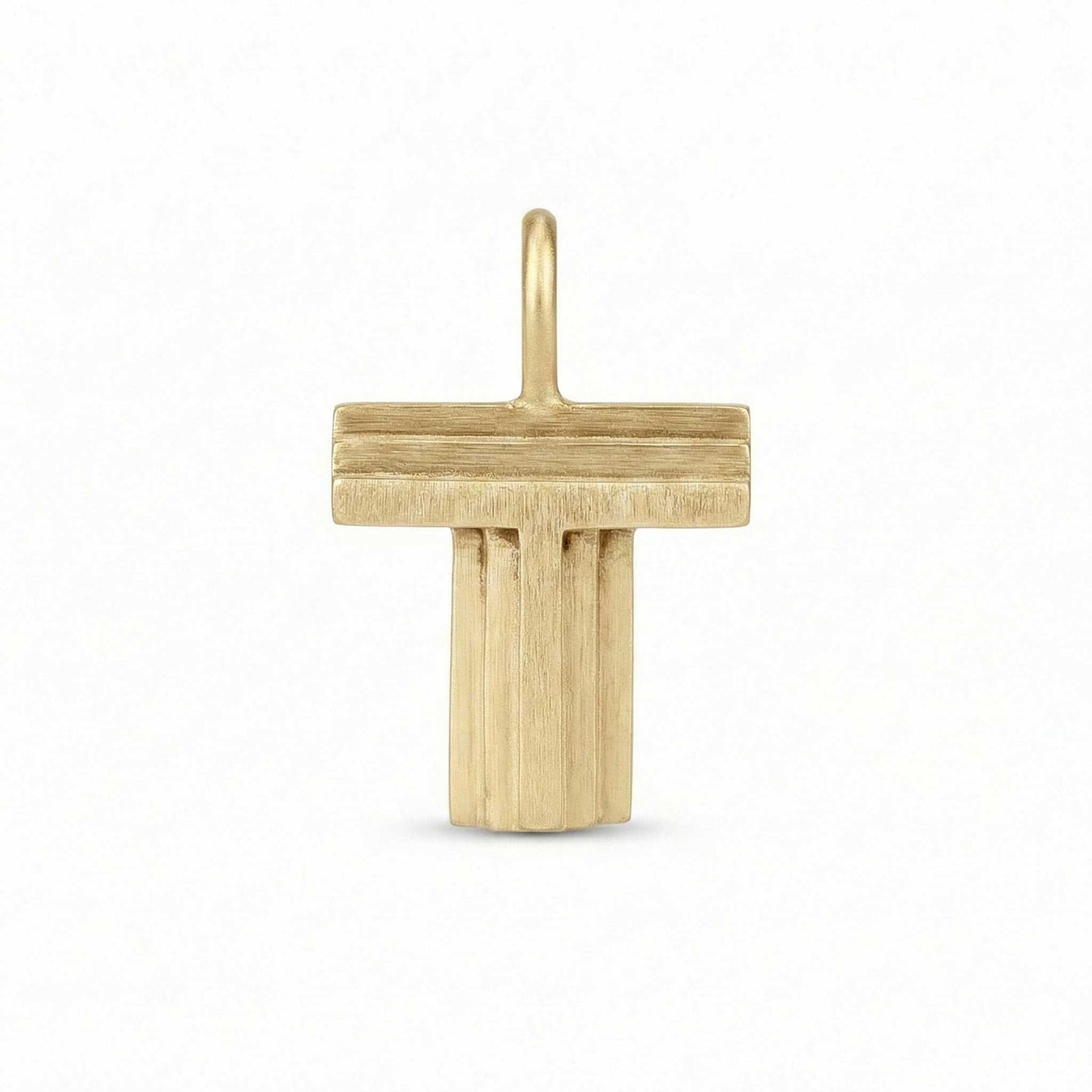 Gold letter 'T' pendant on a white background