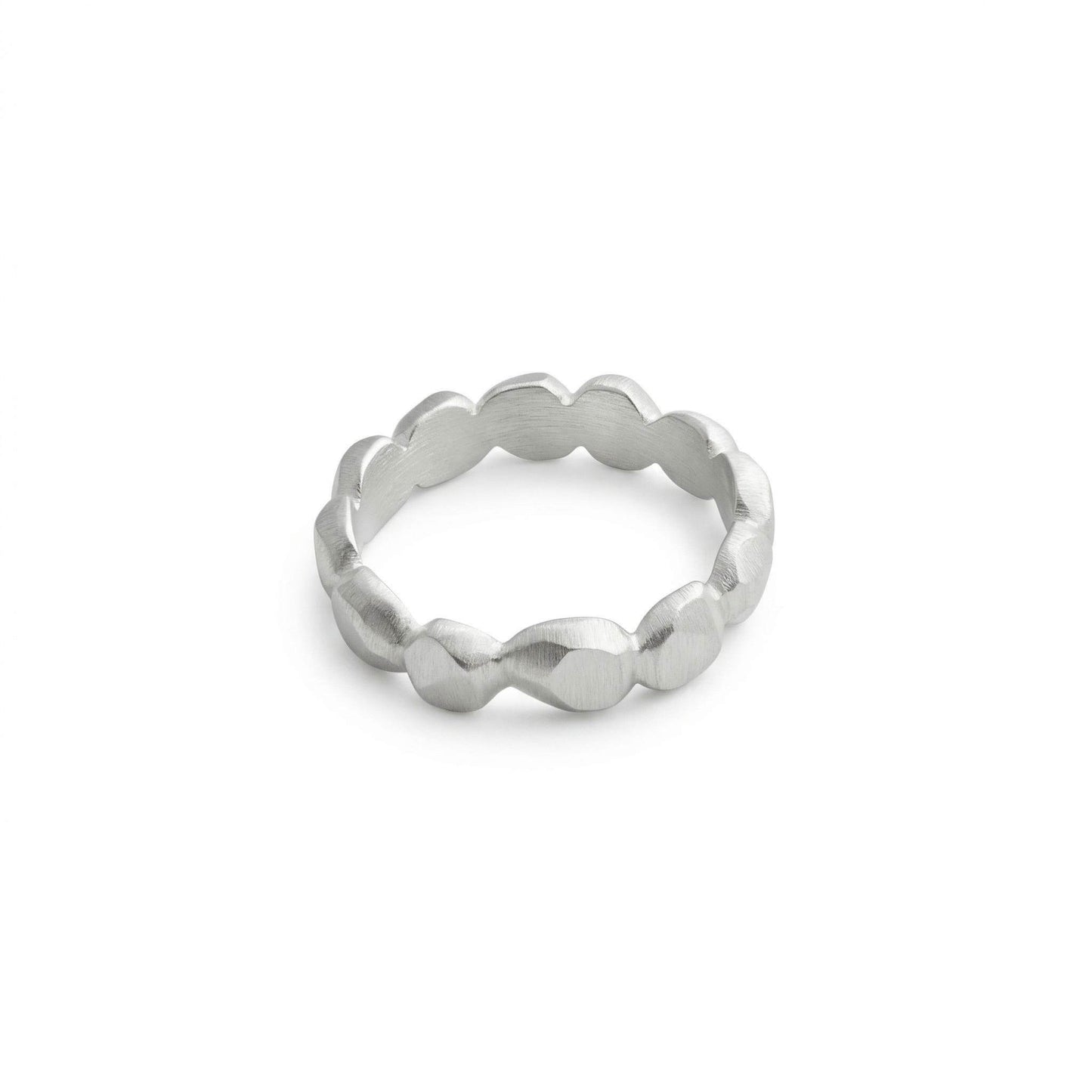 Silver ring with a textured band on a light gray background