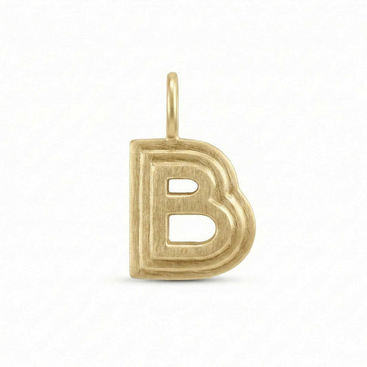 Gold letter 'B' pendant on a white background