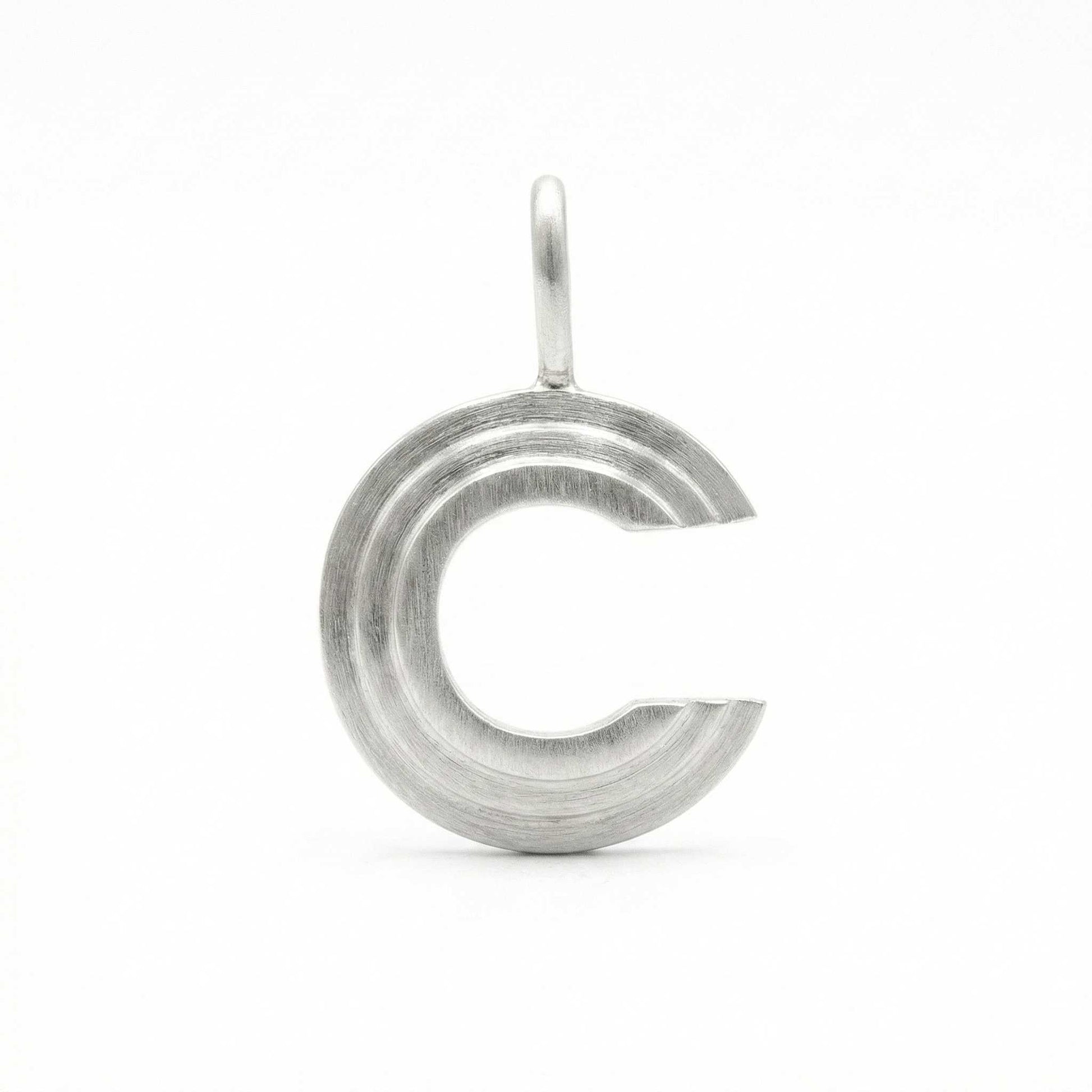 Silver letter 'C' pendant on a white background