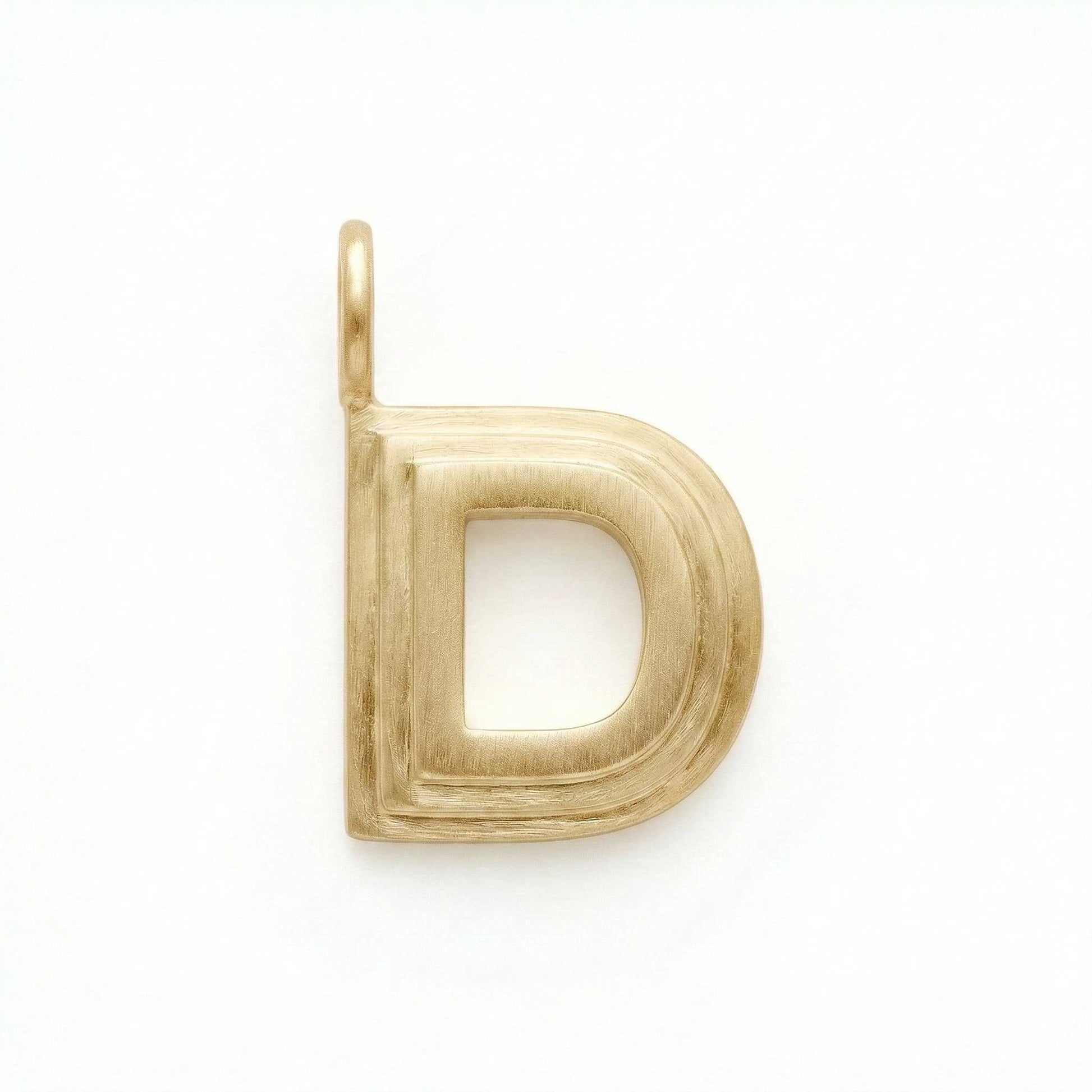 Gold letter 'D' pendant on a white background