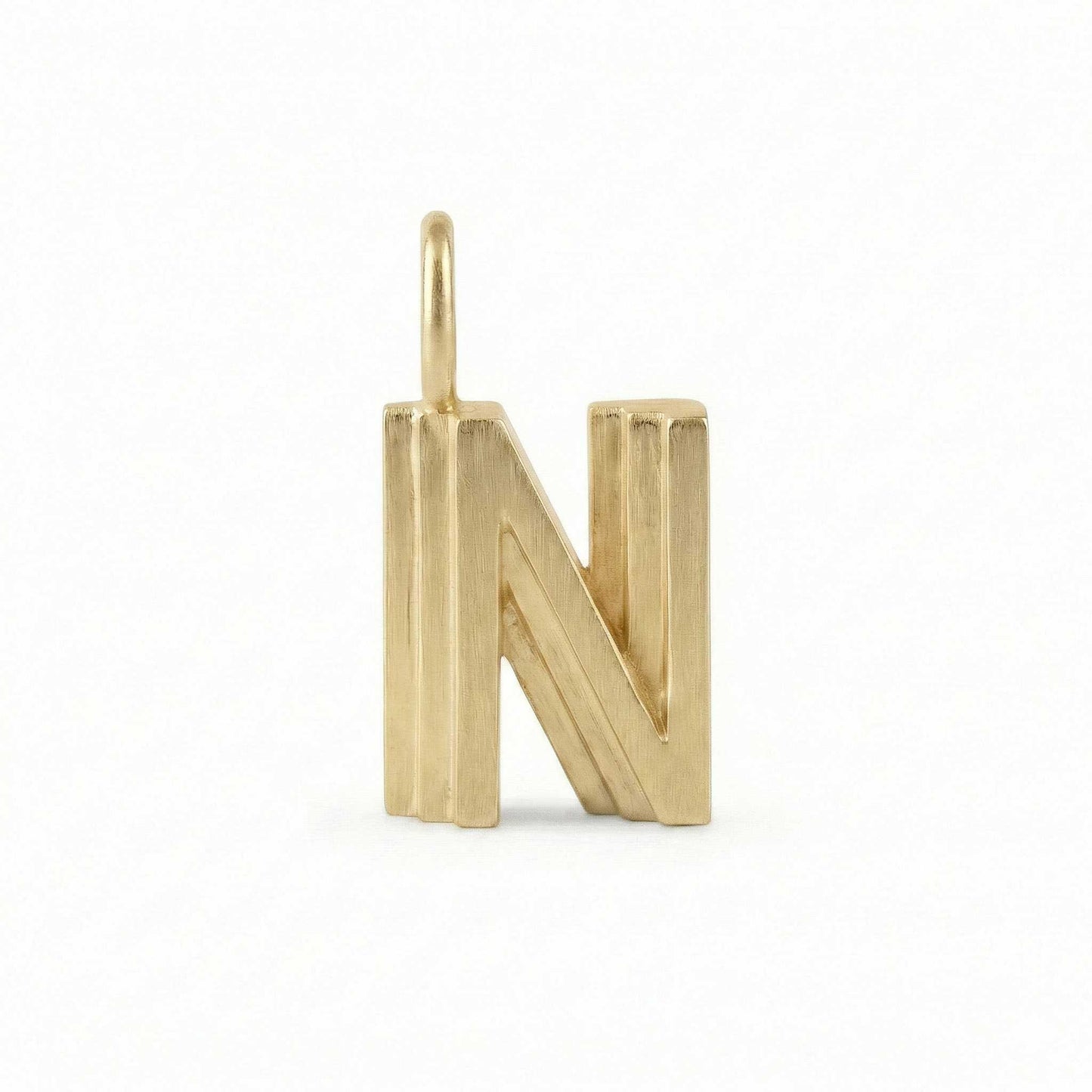Gold letter 'N' pendant on a white background
