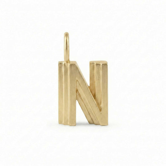 Gold letter 'N' pendant on a white background