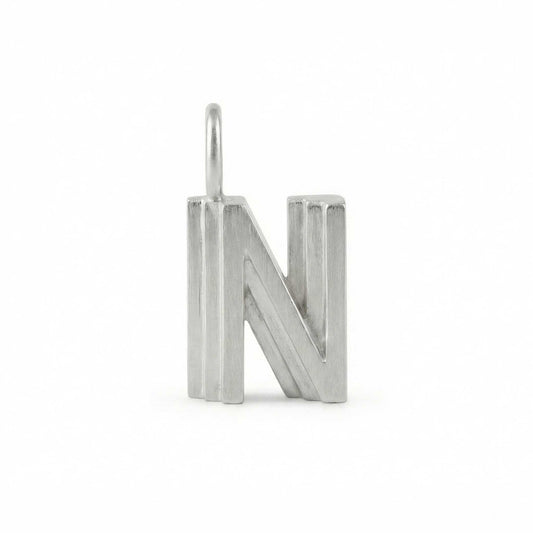 Silver letter 'N' pendant on a white background