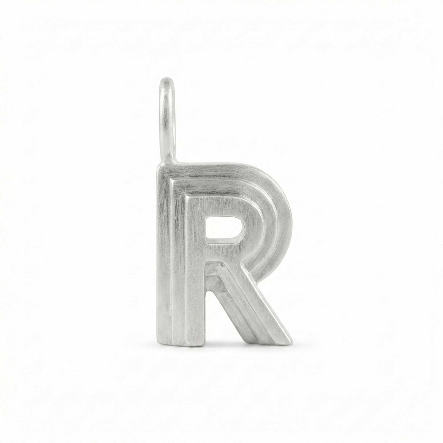 Silver letter 'R' pendant on a white background