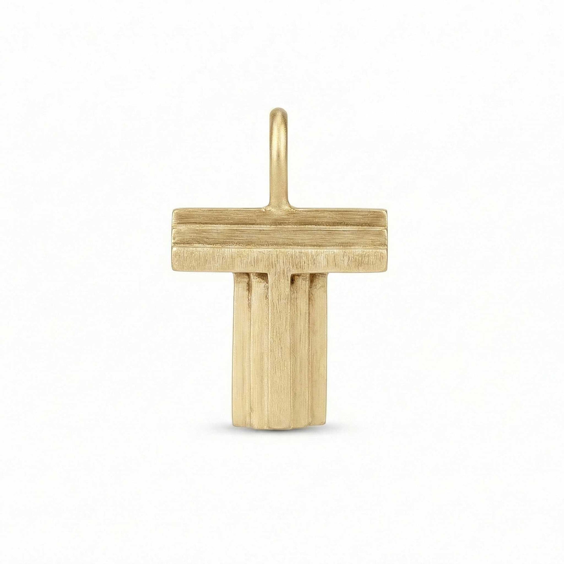 Gold letter 'T' pendant on a white background