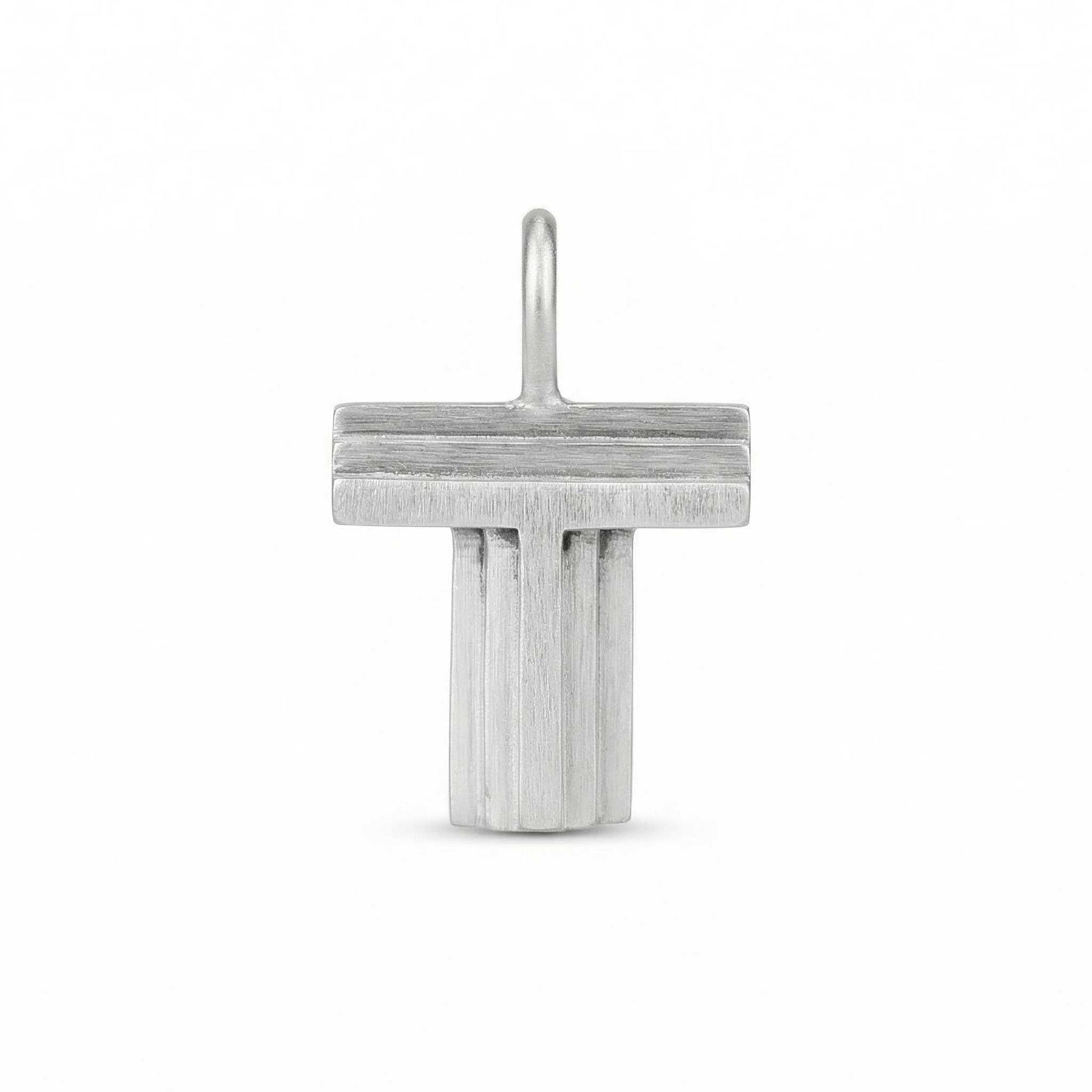 Silver letter 'T' pendant on a white background