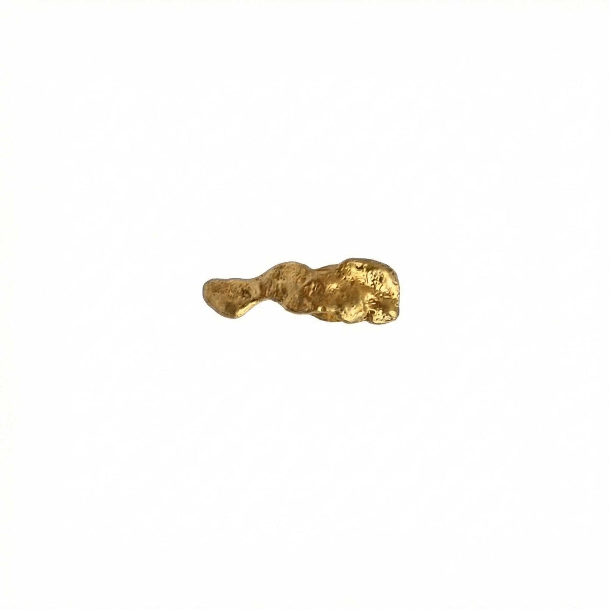 Gold earring on a white background