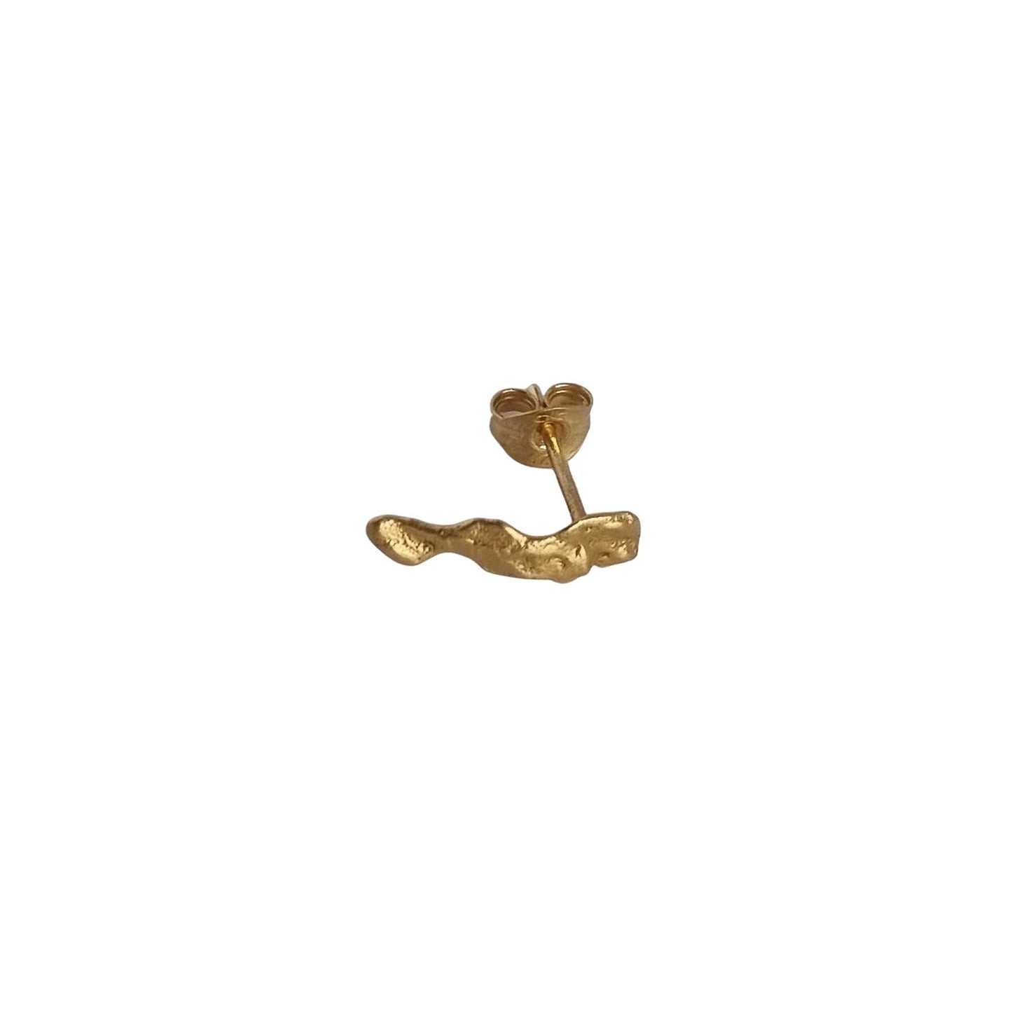 Gold earring on a white background