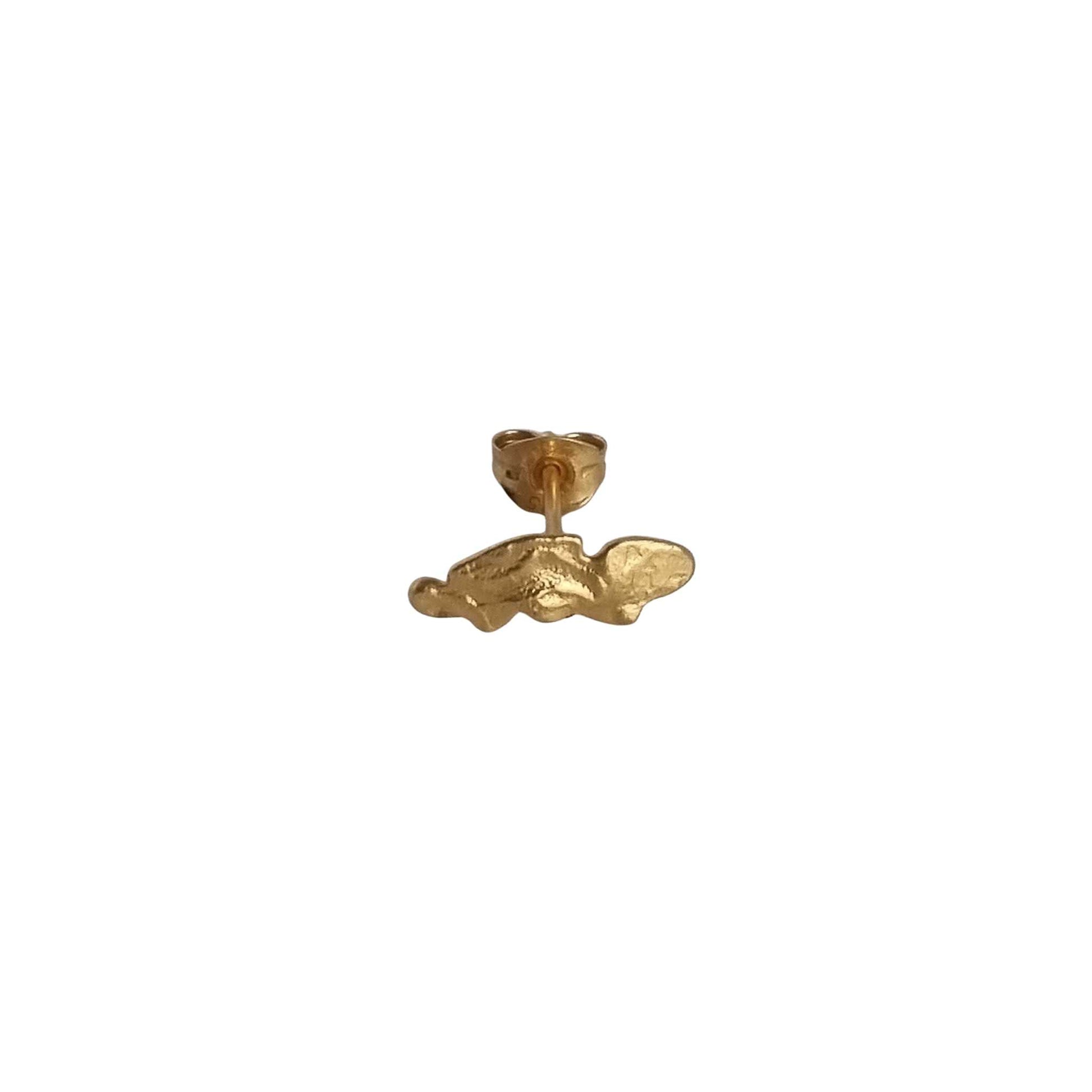 Gold earring on a white background