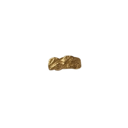 Gold earring on a white background