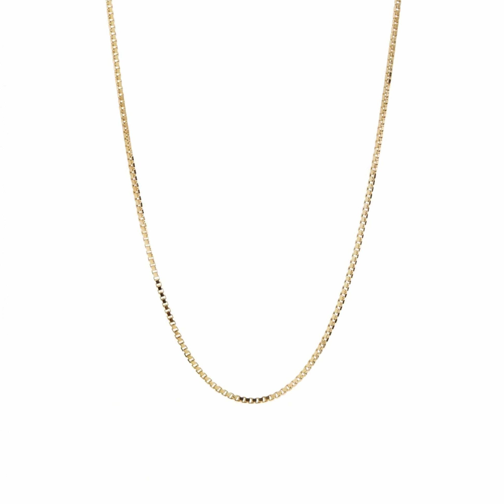 Gold Venezia chain necklace on a white background